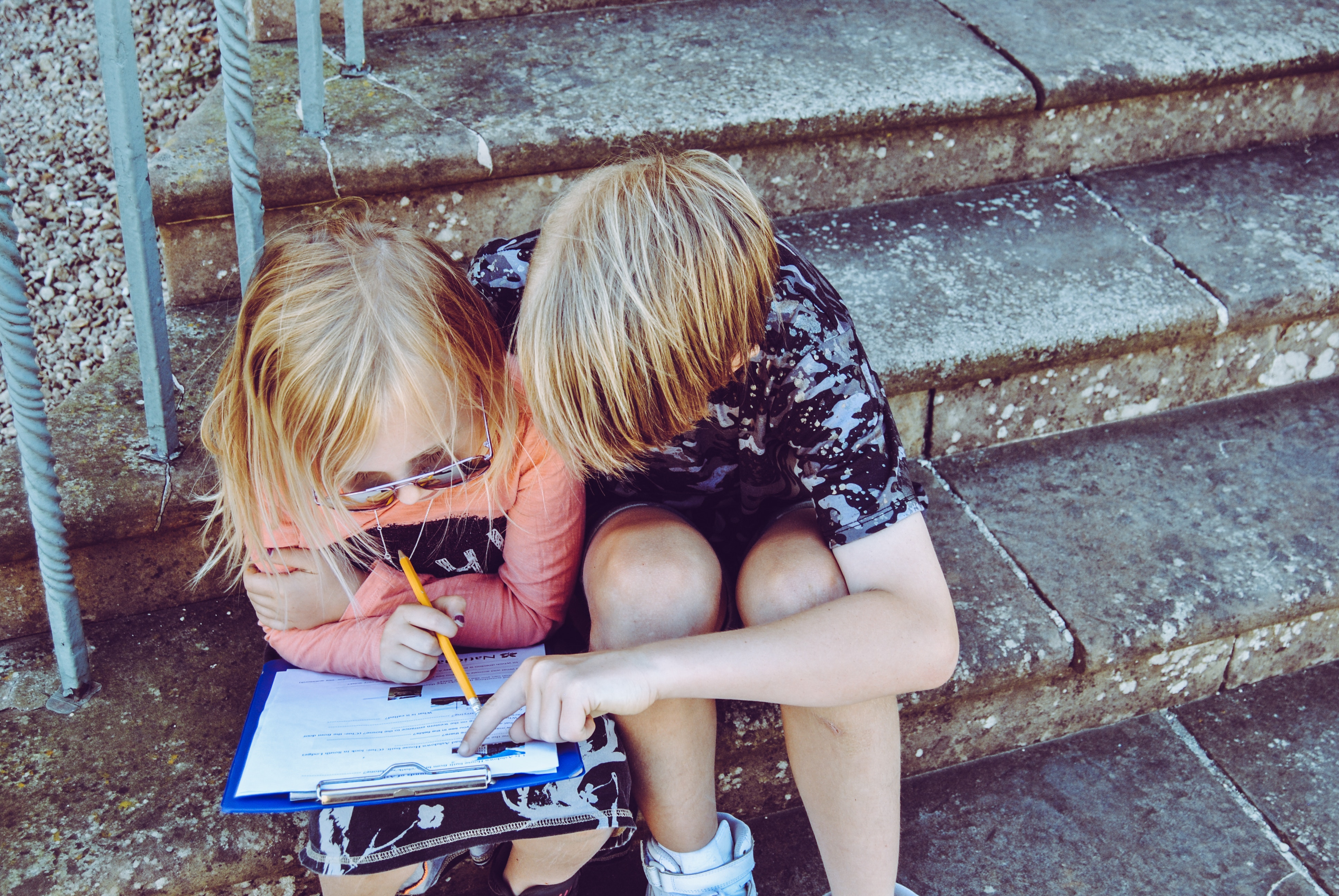 Big brother helping little sister