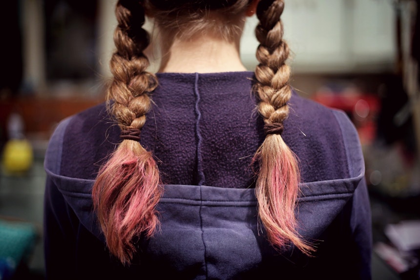 Girl with pink plaited hair.