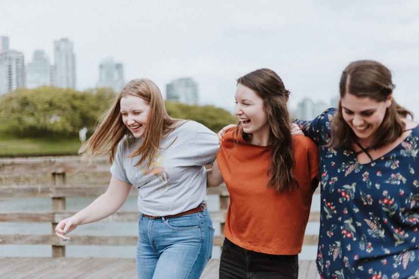 Girls walking and laughing together.
