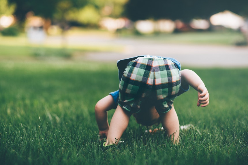 Baby bending over
