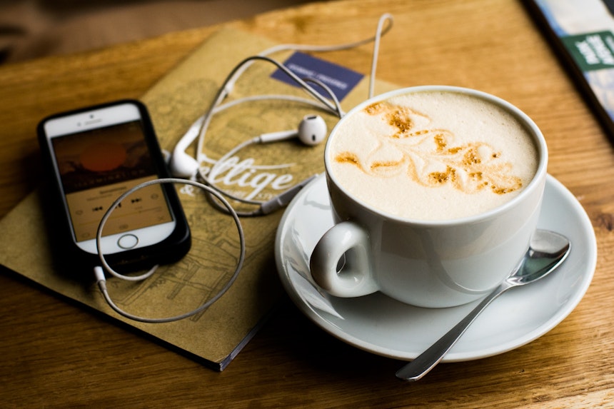 Coffee cup and earphones